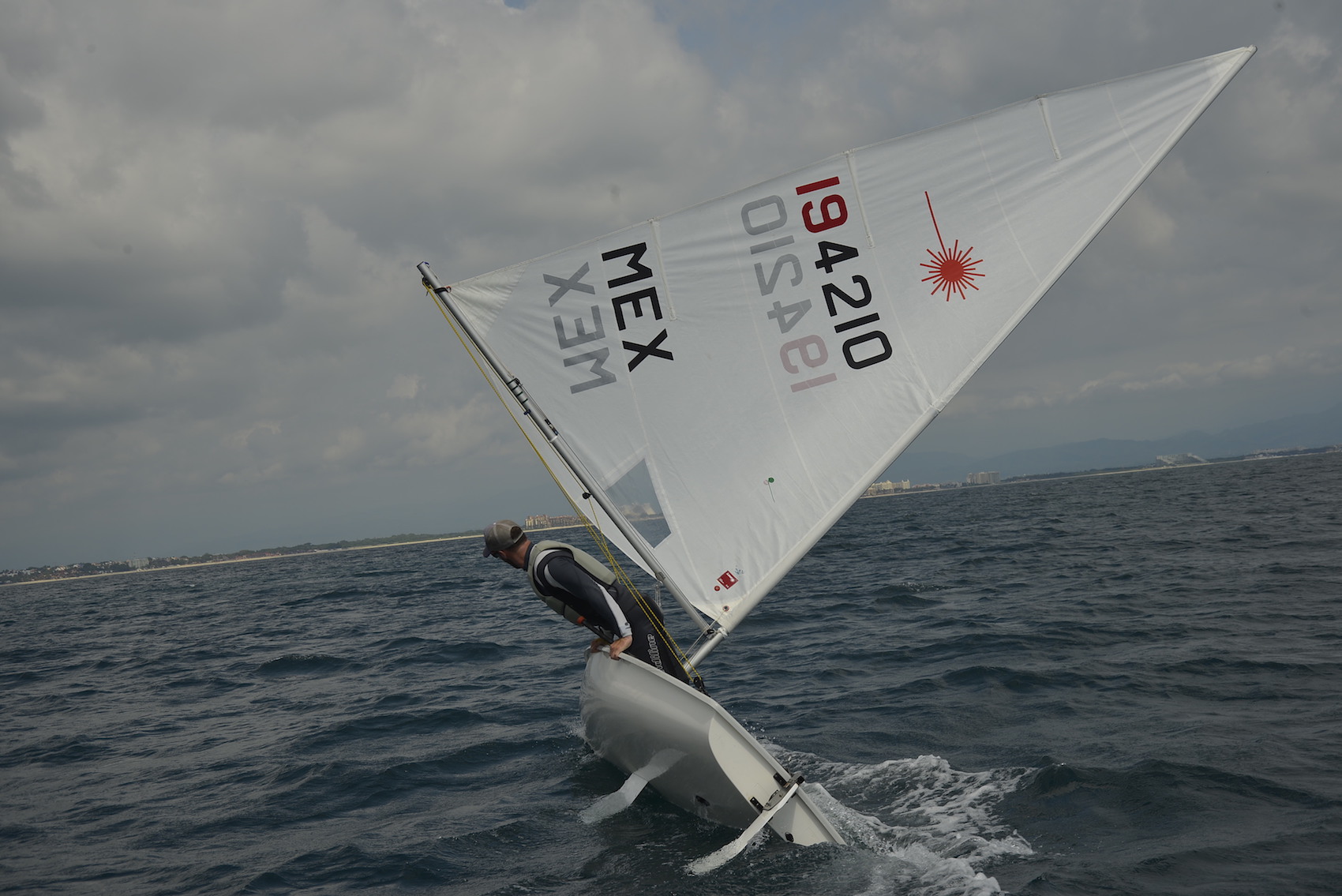 ILCA sailor downwind in breeze
